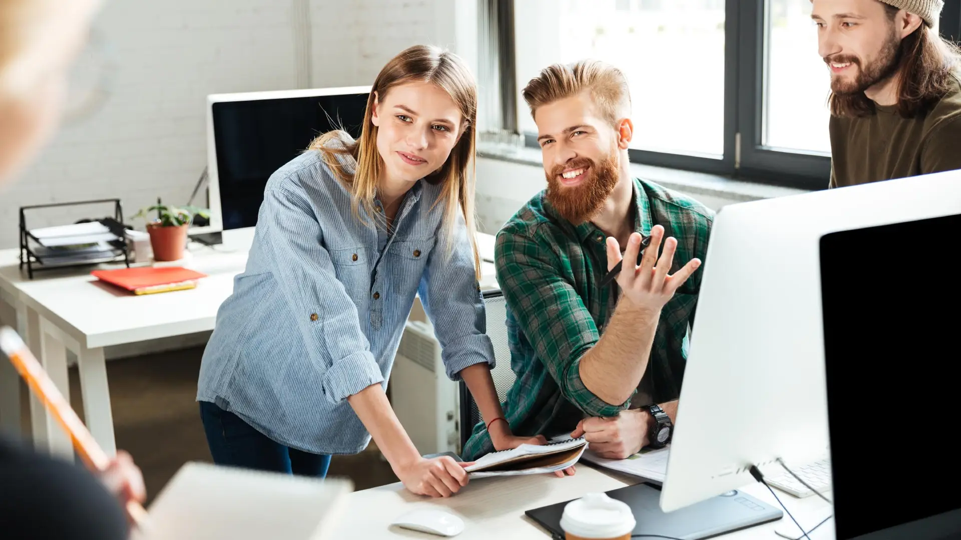 happy colleagues office talking with each other